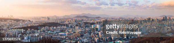 seoul sunset aerial panorama across cityscape to gangnam itaewon namsan - lotte world tower stock pictures, royalty-free photos & images