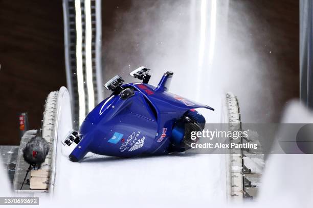 Brad Hall and Nick Gleeson of Team Great Britain crash during the 2-man Bobsleigh Heat 3 on day 11 of Beijing 2022 Winter Olympic Games at National...