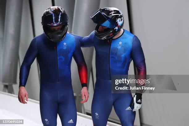 Brad Hall and Nick Gleeson of Team Great Britain react after crashing during the 2-man Bobsleigh Heat 3 on day 11 of Beijing 2022 Winter Olympic...