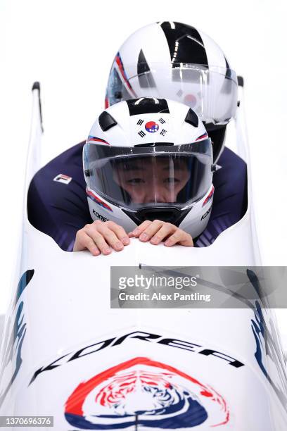 Yunjong Won and Jinsu Kim of Team South Korea react during the 2-man Bobsleigh Heat 3 on day 11 of Beijing 2022 Winter Olympic Games at National...