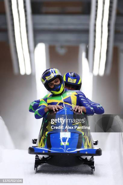 Edson Luques Bindilatti and Edson Ricardo Martins of Team Brazil react during the 2-man Bobsleigh Heat 3 on day 11 of Beijing 2022 Winter Olympic...