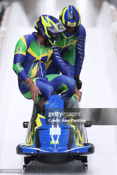 Edson Luques Bindilatti and Edson Ricardo Martins of Team Brazil react during the 2-man Bobsleigh Heat 3 on day 11 of Beijing 2022 Winter Olympic...