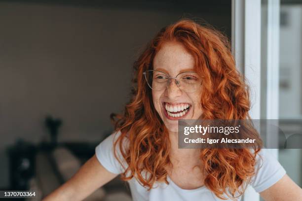 portrait of smiling a red-haired woman - wavy hair stock pictures, royalty-free photos & images