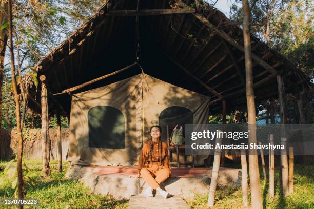 female traveler contemplating african sunrise from the camping site - tarangire national park 個照片及圖片檔