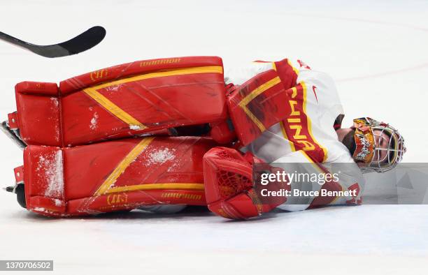 Shimisi Jieruimi of Team China on the ice with an injury in the first period during the Men’s Ice Hockey Qualification Playoff match between Team...