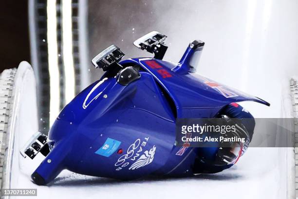 Brad Hall and Nick Gleeson of Team Great Britain crash during the 2-man Bobsleigh Heat 3 on day 11 of Beijing 2022 Winter Olympic Games at National...