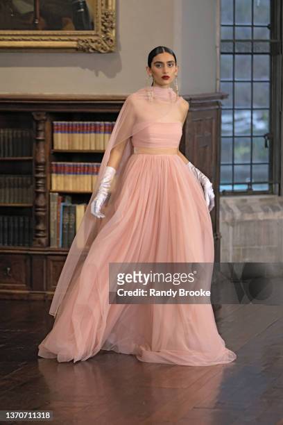 In this image released on February 15 a model walks the runway during the Badgley Mischka Fall 2022 digital fashion show at Coe Hall at The Planting...