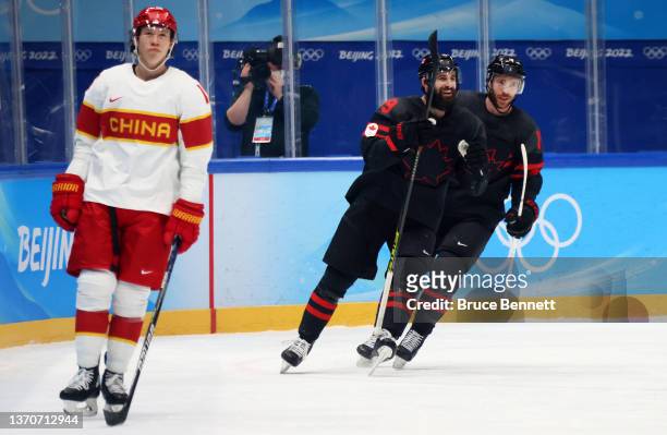 Eric O'Dell and Benjamin Street of Team Canada celebrate a goal in the second period during the Men’s Ice Hockey Qualification Playoff match between...