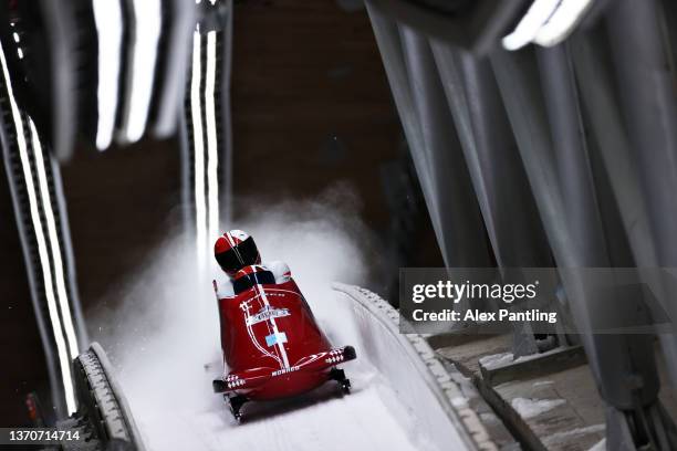 Rudy Rinaldi and Boris Vain of Team Monaco react during the 2-man Bobsleigh Heat 4 on day 11 of Beijing 2022 Winter Olympic Games at National Sliding...