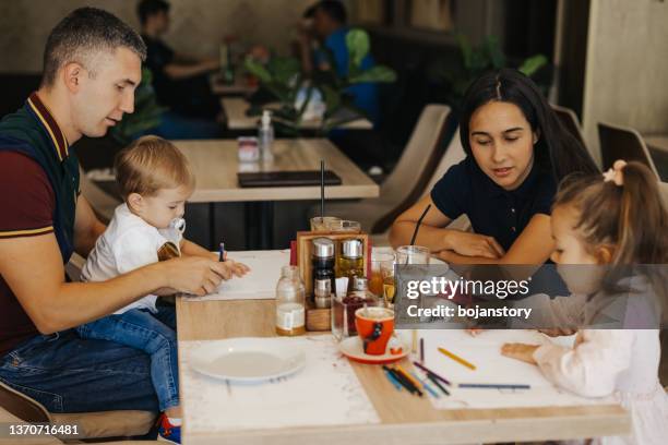 family enjoying free time together - lunch room drawing stock pictures, royalty-free photos & images