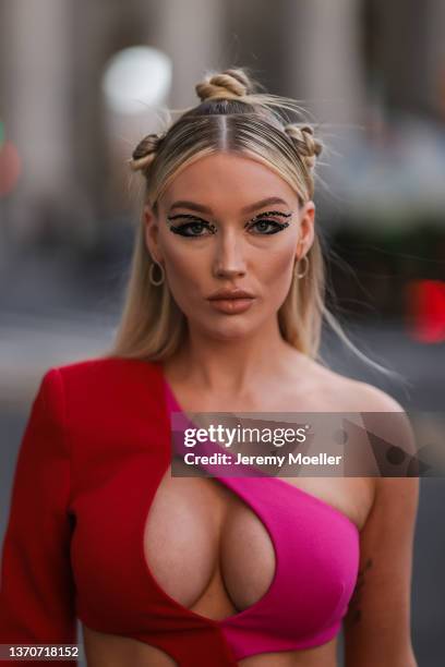 Meredith Duxbury wearing a red mini dress outside PatBo during New York City Fashion Week on February 12, 2022 in New York City.