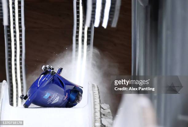 Brad Hall and Nick Gleeson of Team Great Britain crash during the two-man Bobsleigh heat 3 on day 11 of Beijing 2022 Winter Olympic Games at National...