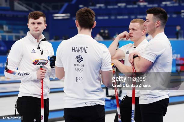 Bruce Mouat, Grant Hardie, Bobby Lammie and Hammy McMillan of Team Great Britain interact while competing against Team Sweden during the Men’s...