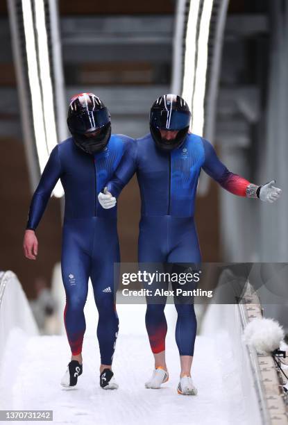 Brad Hall and Nick Gleeson of Team Great Britain react after crashing during the two-man Bobsleigh heat 3 on day 11 of Beijing 2022 Winter Olympic...