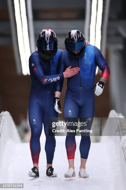 Brad Hall and Nick Gleeson of Team Great Britain react after crashing during the two-man Bobsleigh heat 3 on day 11 of Beijing 2022 Winter Olympic...