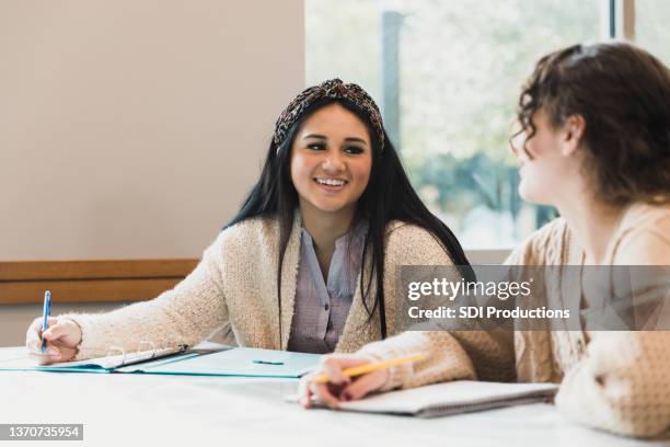 teen girls get to know each other in class - learn arabic stock pictures, royalty-free photos & images