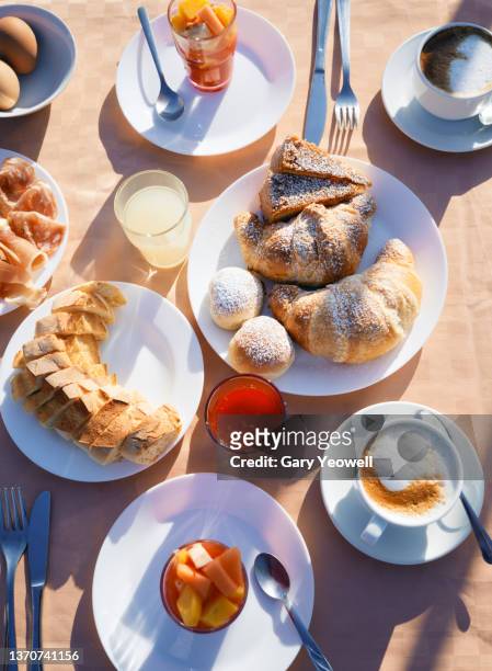 continental breakfast with coffee, fruit and croissants - croissant jam stock pictures, royalty-free photos & images