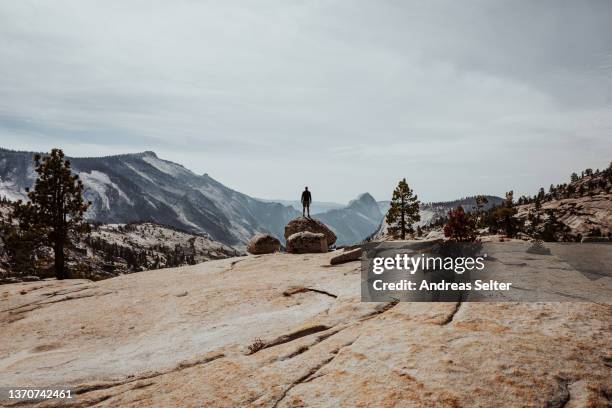 single person standing on a rock - parque nacional de las montañas de guadalupe fotografías e imágenes de stock