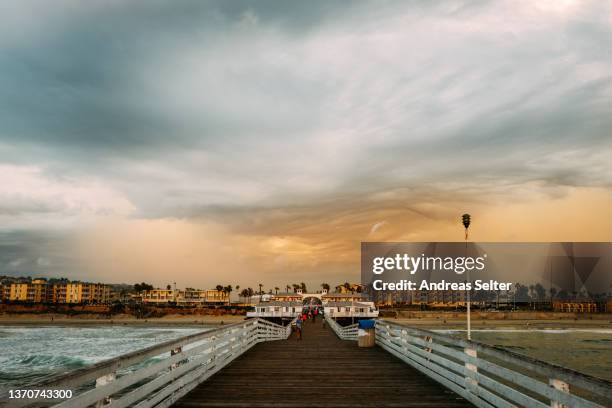 dramatic cloud formation over san diego at pacific beach on crystal pier - san diego pacific beach stock pictures, royalty-free photos & images