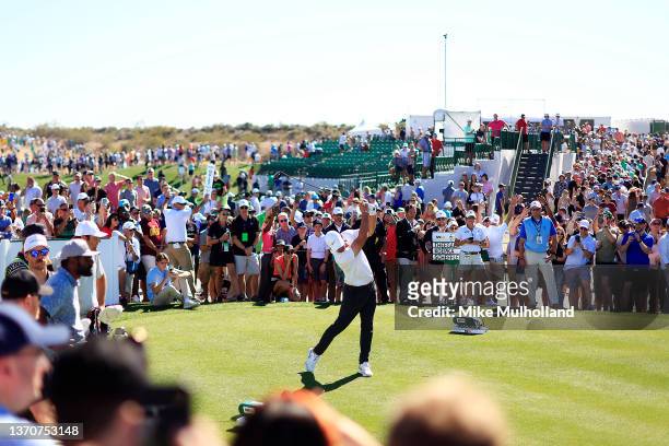 Brooks Koepka of the United States hits his tee shot on the 11th hole during the final round of the WM Phoenix Open at TPC Scottsdale on February 13,...