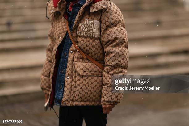 Guest wears a brown felt beret, a red with black and white print pattern scarf, a navy blue denim shirt, a beige and brown GG monogram print pattern...