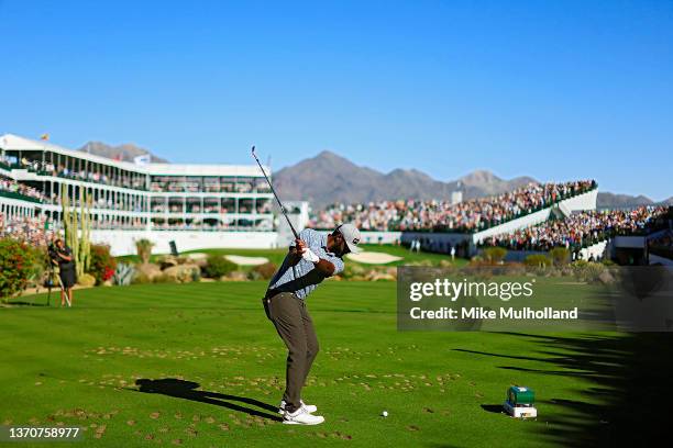 Sahith Theegala of the United States hits his tee shot on the 16th hole during the final round of the WM Phoenix Open at TPC Scottsdale on February...