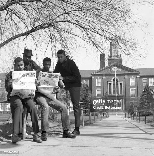 Students who normally attend Gary's Roosevelt High School read newspapers bannering "Today is Freedom Day in Gary Public Schools" as thousands of...