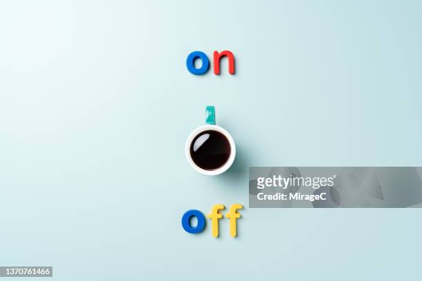 turn on a switch consists of a cup of coffee and alphabets - multi coloured buttons stock pictures, royalty-free photos & images