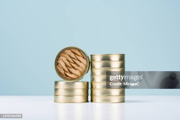 tinned fish, sardine cans stack - sardine tin stock pictures, royalty-free photos & images