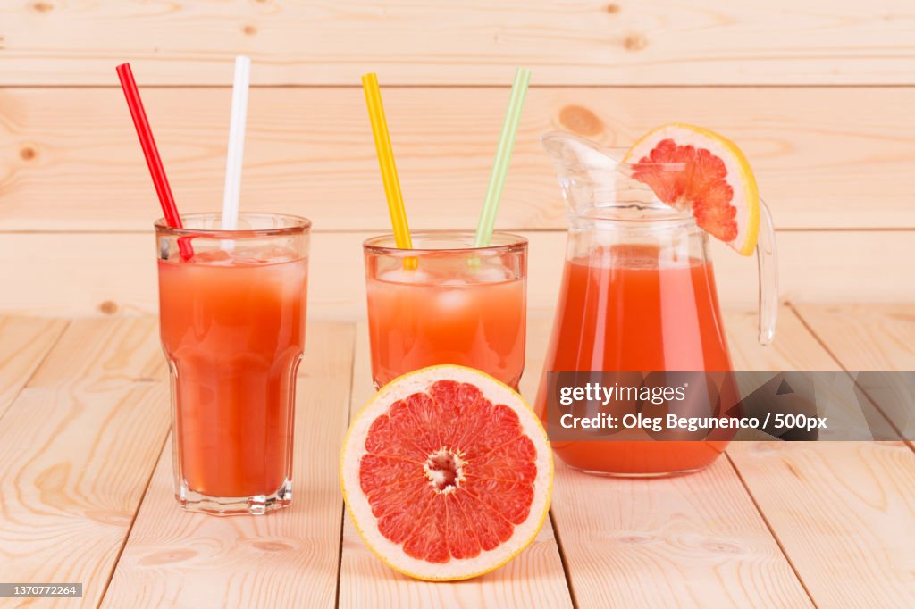 Full glass and jug of grapefruit juice,Moldova