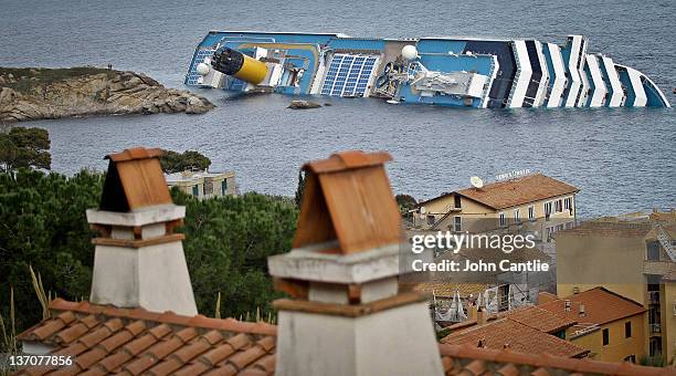 The cruise ship Costa Concordia lies stricken off the shore of the island of Giglio, on January 15, 2012 in Giglio Porto, Italy. Three survivors have...