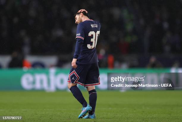 Lionel Messi of Paris Saint-Germain reacts after missing a penalty during the UEFA Champions League Round Of Sixteen Leg One match between Paris...