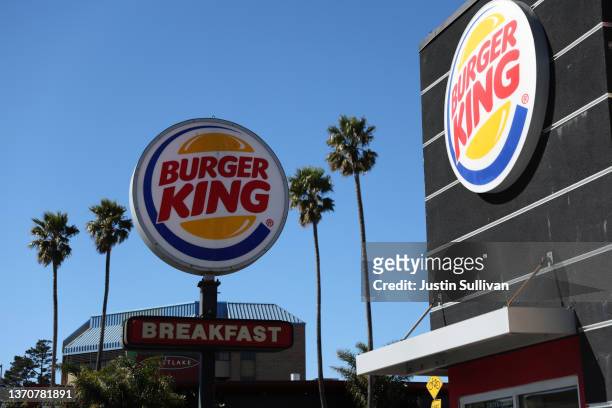 Sign is posted in front of a Burger King restaurant on February 15, 2022 in Daly City, California. Restaurant Brands International, the parent...