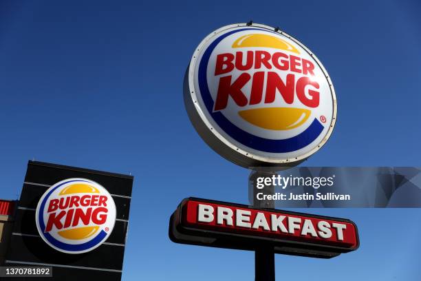 Sign is posted in front of a Burger King restaurant on February 15, 2022 in Daly City, California. Restaurant Brands International, the parent...