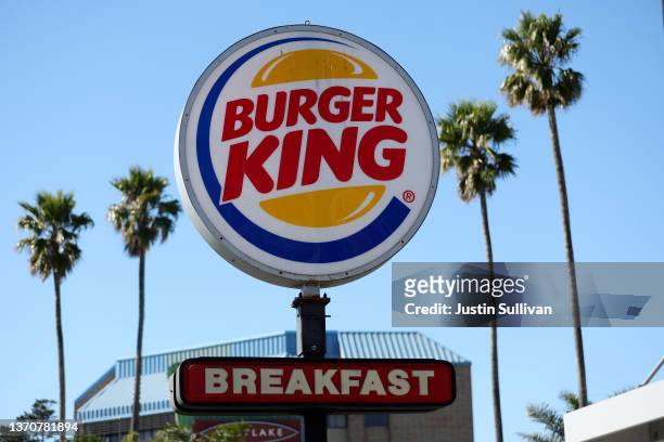 Sign is posted in front of a Burger King restaurant on February 15, 2022 in Daly City, California. Restaurant Brands International, the parent...