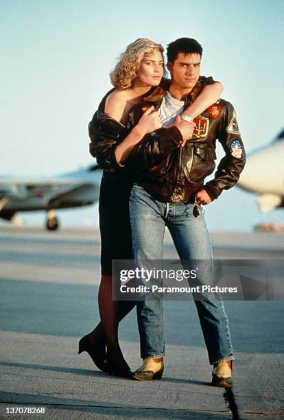 American actors Tom Cruise, as Lieutenant Pete 'Maverick' Mitchell, and Kelly McGillis, as Charlotte 'Charlie' Blackwood, in a promotional portrait...