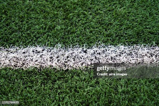 close up view of artificial turf with white markings delimiting a soccer field. - football field bildbanksfoton och bilder