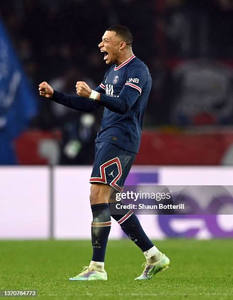 Kylian Mbappe of Paris Saint-Germain celebrates after scoring their team's first goal during the UEFA Champions League Round Of Sixteen Leg One match...