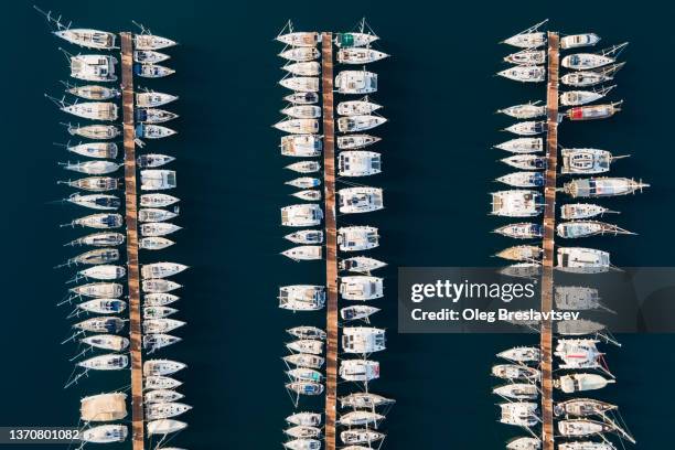aerial drone view of luxury yacht marina. top view, lines, abstract and geometry background with copy space - spartan cruiser stock pictures, royalty-free photos & images