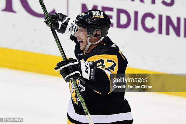 Sidney Crosby of the Pittsburgh Penguins celebrates after scoring his 500th NHL goal during the first period against the Philadelphia Flyers at PPG...