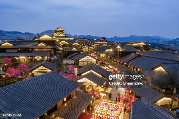 tang dynasty style town in qingdao city, shandong province, china - chinese lantern festival stockfoto's en -beelden