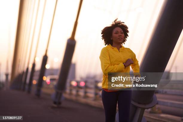 silhouette of woman running exercise morning on city street - morning exercise stock pictures, royalty-free photos & images