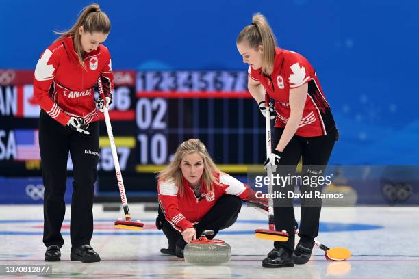 Jocelyn Peterman, Jennifer Jones and Dawn McEwen of Team Canada compete against Team United States during the Women's Round Robin Session on Day 12...