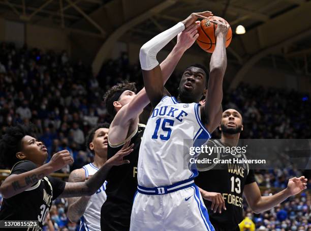 Mark Williams of the Duke Blue Devils battles Jake LaRavia of the Wake Forest Demon Deacons for a rebound during the second half at Cameron Indoor...