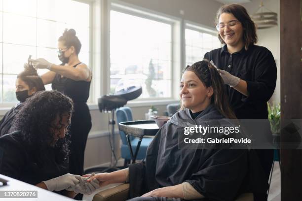 woman dyeing and cutting her hair in the beauty salon - 19 to 22 years old stock pictures, royalty-free photos & images