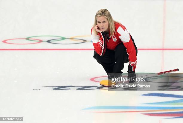 Jennifer Jones of Team Canada watches the game winning stone slide into the house against Team United States during the Women's Round Robin Session...