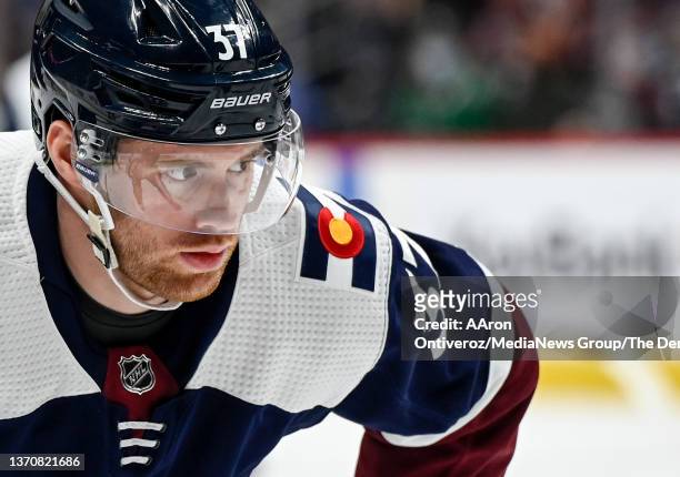 Compher of the Colorado Avalanche prepares for a face-off against the Dallas Stars during the first period at Ball Arena on Tuesday, February 15,...