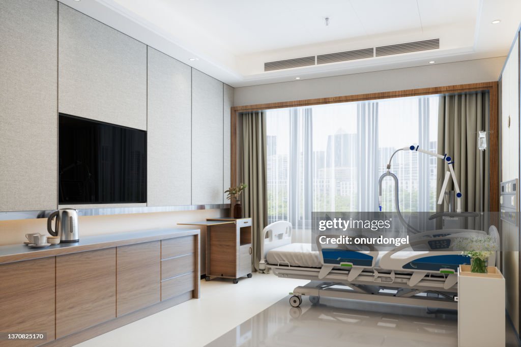 Modernes Luxus-Krankenhauszimmer Interieur mit leerem Bett, LCD-Fernseher und Blick auf die Stadt aus dem Fenster