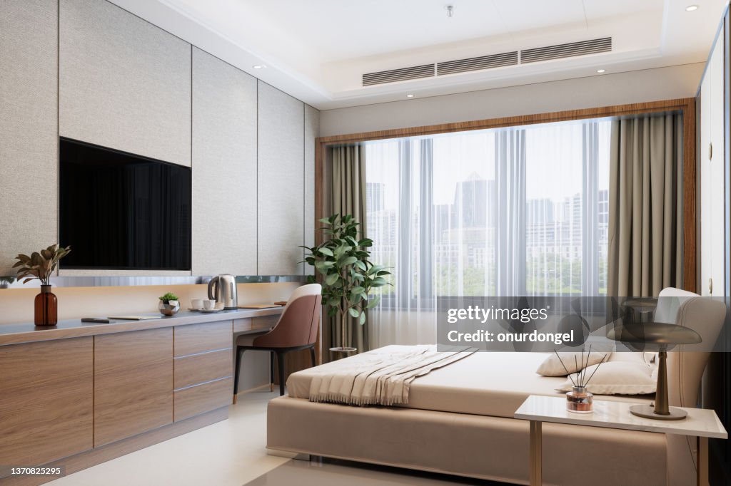 Modern Hotel Room With Double Bed, Night Tables, Tv Set And Cityscape From The Window