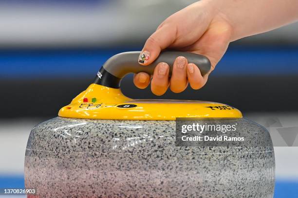 SeonYeong Kim of Team Korea has Olympic Rings painted on her nails during the Women's Round Robin Session against Team Switzerland on Day 12 of the...